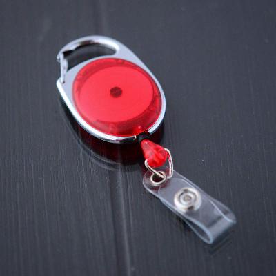 Punainen läpikuultava karabiinijojo vinyylilenkillä ja nepparilla esimerkiksi korttipidikkeelle